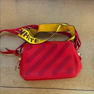 Stylish Red Crossbody Bag with Yellow Strap